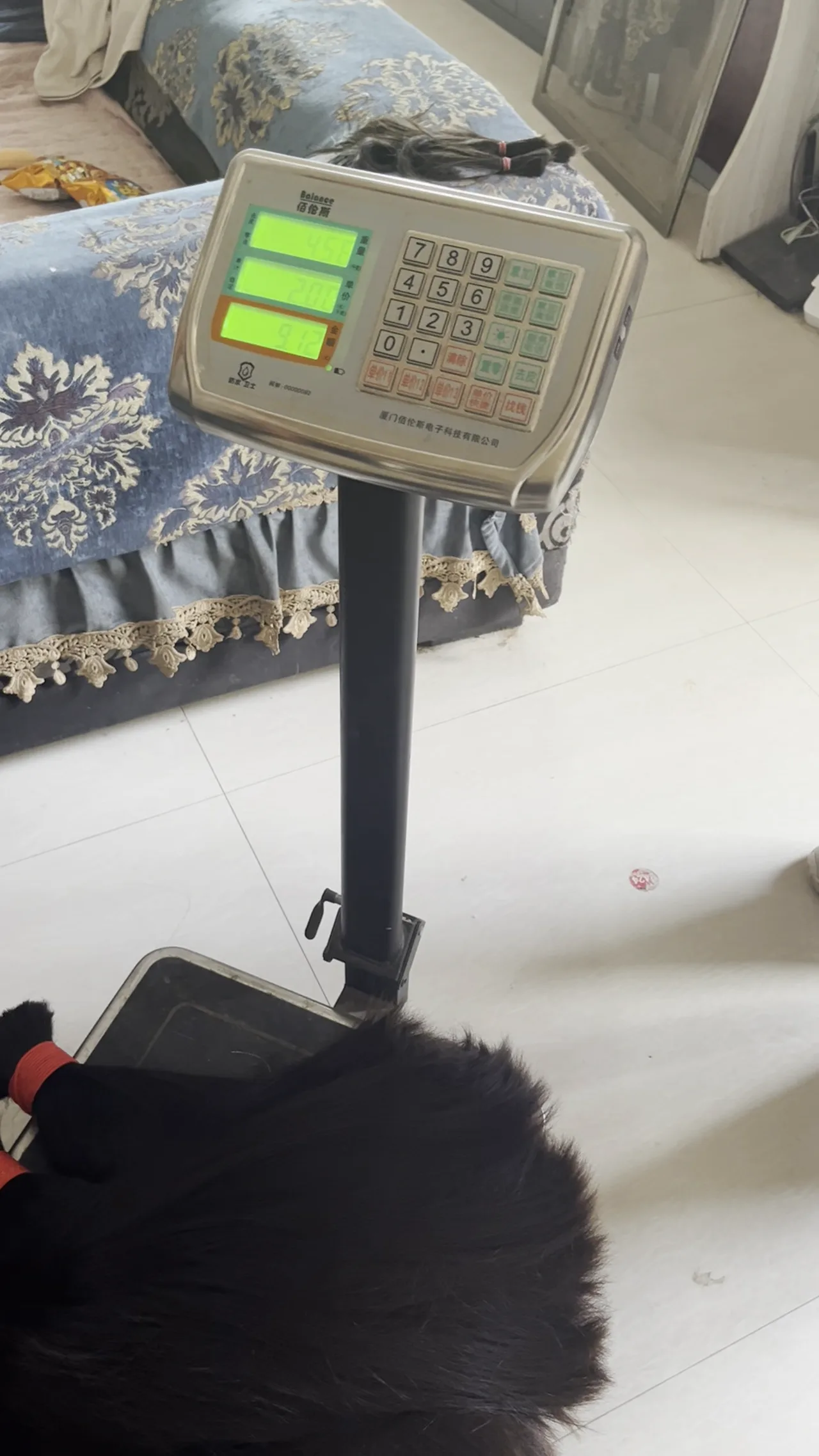 Hair bundles being checked on a weighing scale