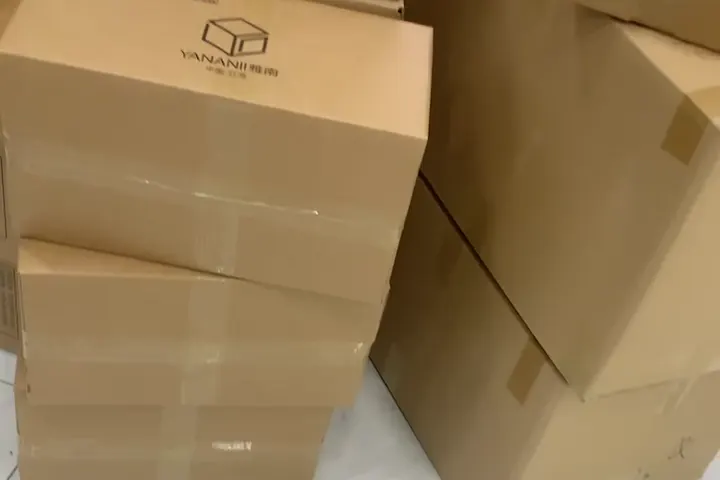 Sealed brown cartons stacked together